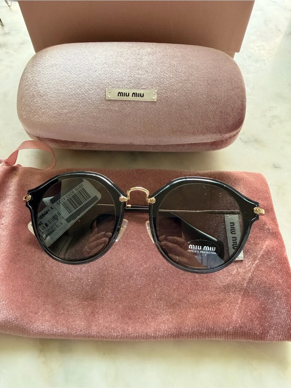 Miu Miu Round Sunglasses